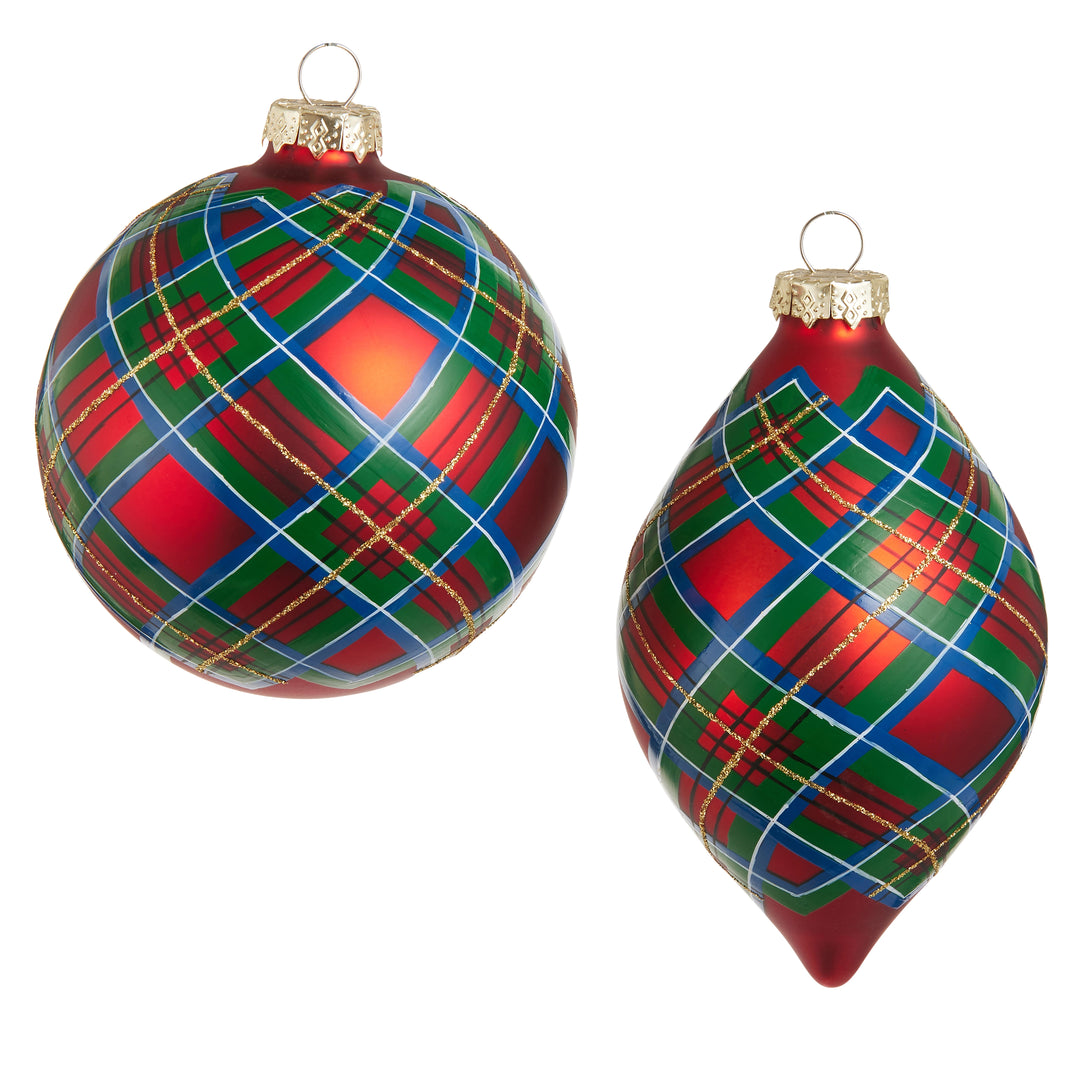 Two Christmas ornaments on a white background: one round and one teardrop-shaped, both decorated with a red, green, and blue tartan plaid pattern and gold glitter lines, with gold caps and hanging loops.