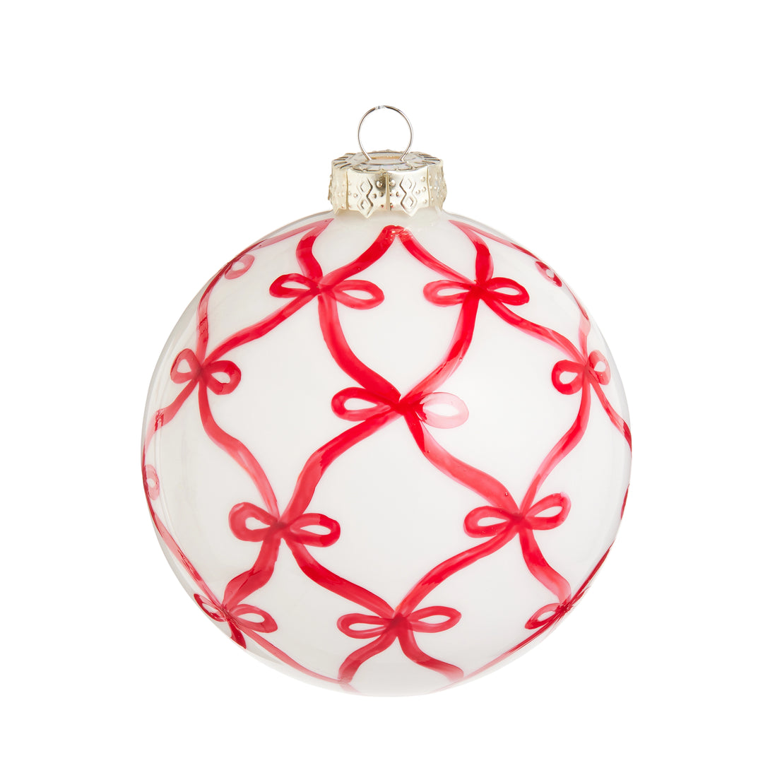 White Christmas ornament with red bow pattern on a white background