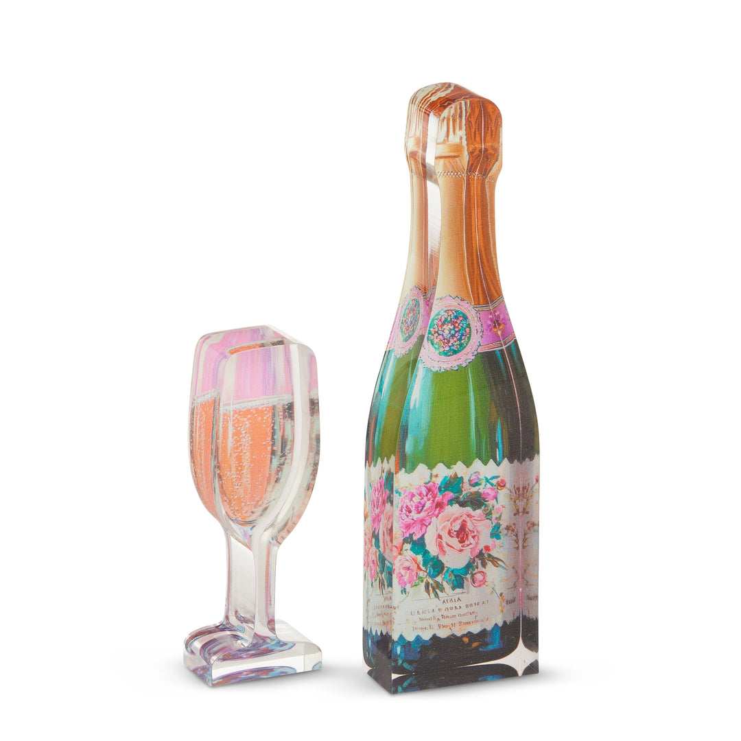 Decorative bottle and glass with floral design on a white background