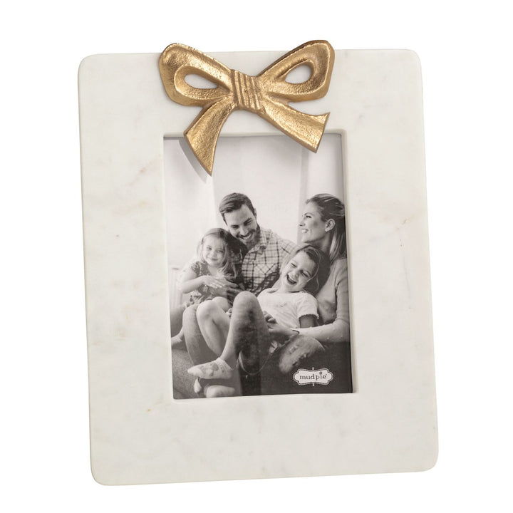 WHITE MARBLE PICTURE FRAME WITH GOLD BOW ON TOP