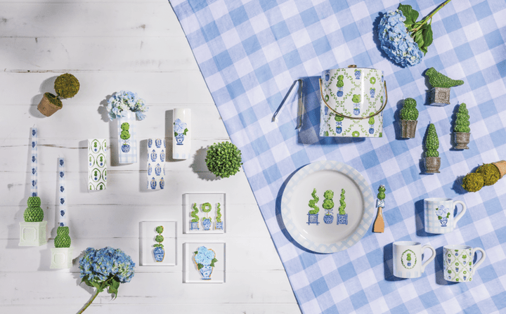 STYLED PHOTO WITH TOPIARY AND BOXWOOD BLUE AND WHITE VASES CUPS AND DISHES