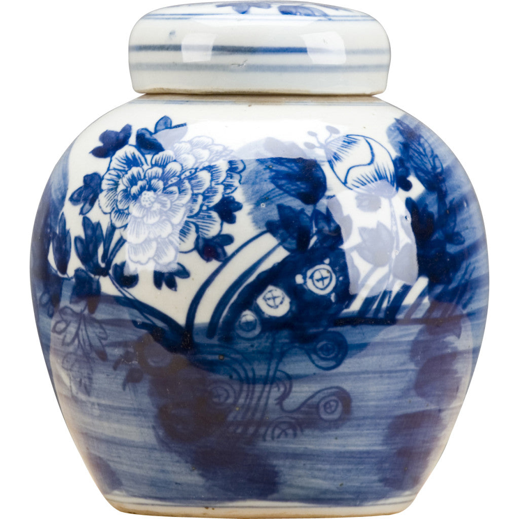 A traditional blue and white glazed ceramic jar with a lid, decorated with hand-painted floral and landscape motifs.