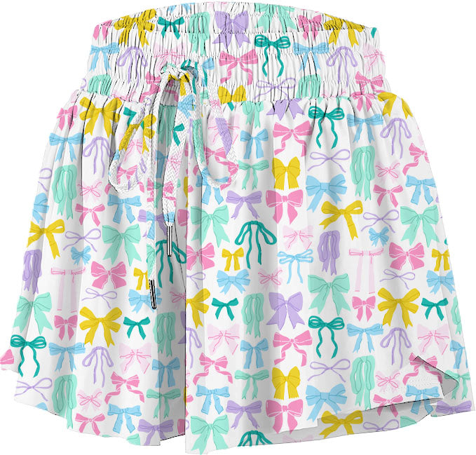 WHITE PULL ON SHORTS WITH PASTEL COLORFUL BOWS PRINTED ALL OVER ON WHITE BACKGROUND