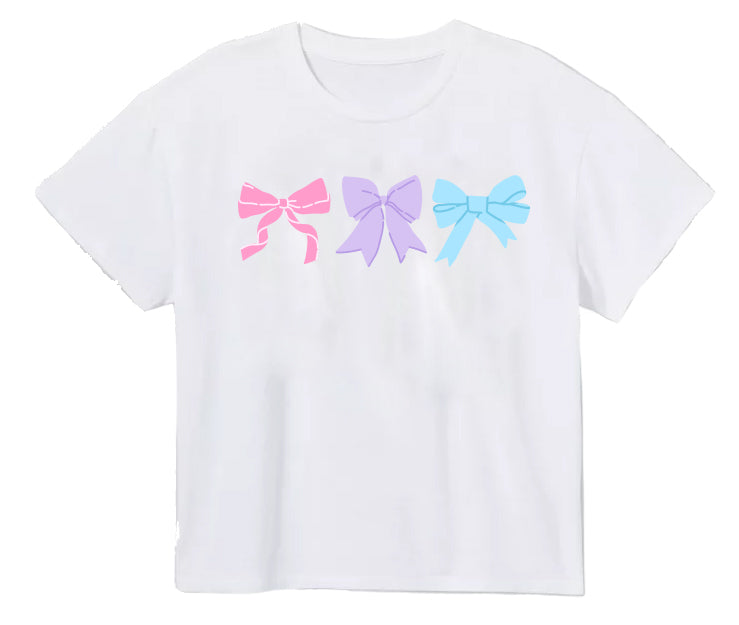 Little girl's boxy t-shirt with pink, purple, and blue bows