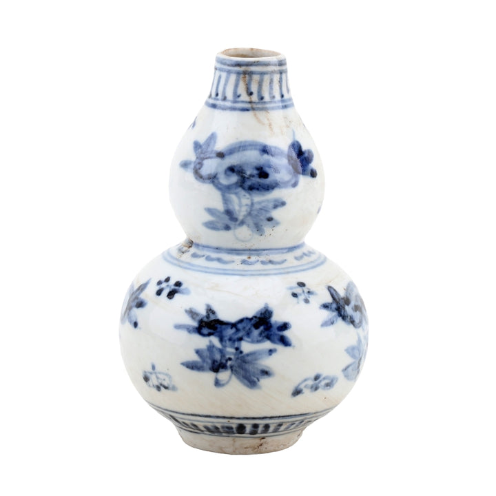 White ceramic vase with blue floral patterns on a white background