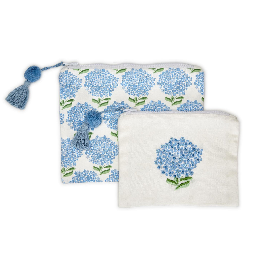 Two pouches with blue floral patterns on a white background