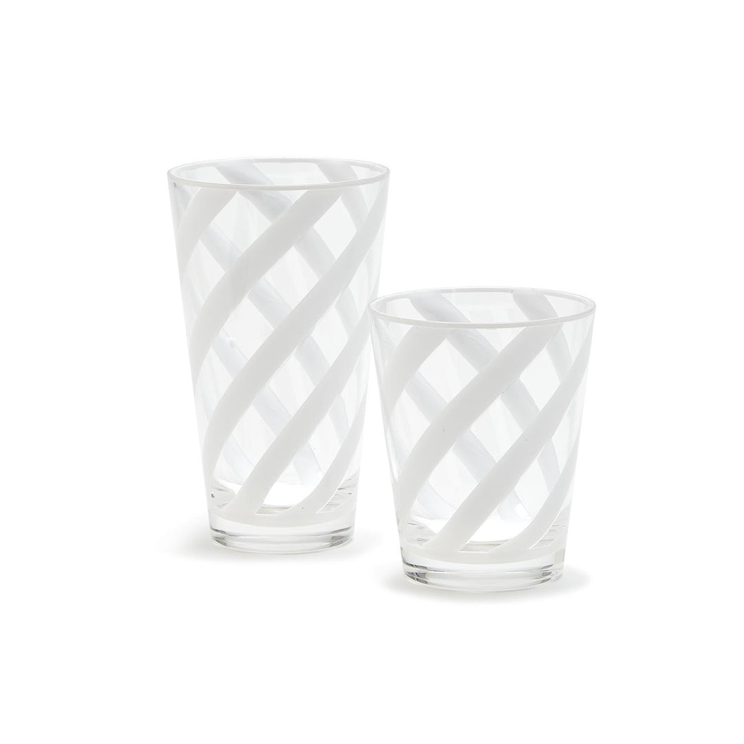 Two clear glass tumblers with a diamond pattern on a white background