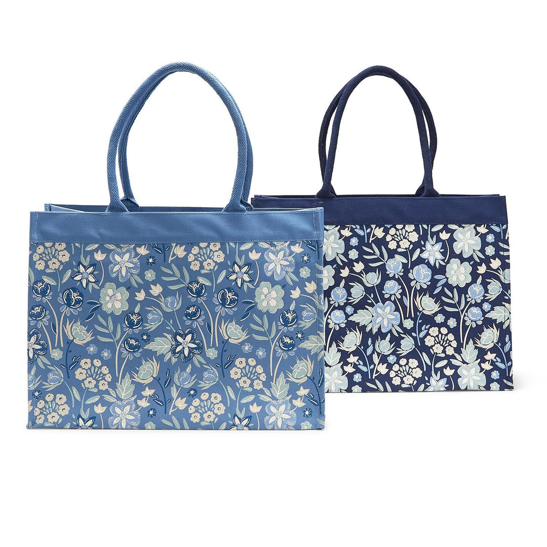 Two blue floral-patterned tote bags on a white background