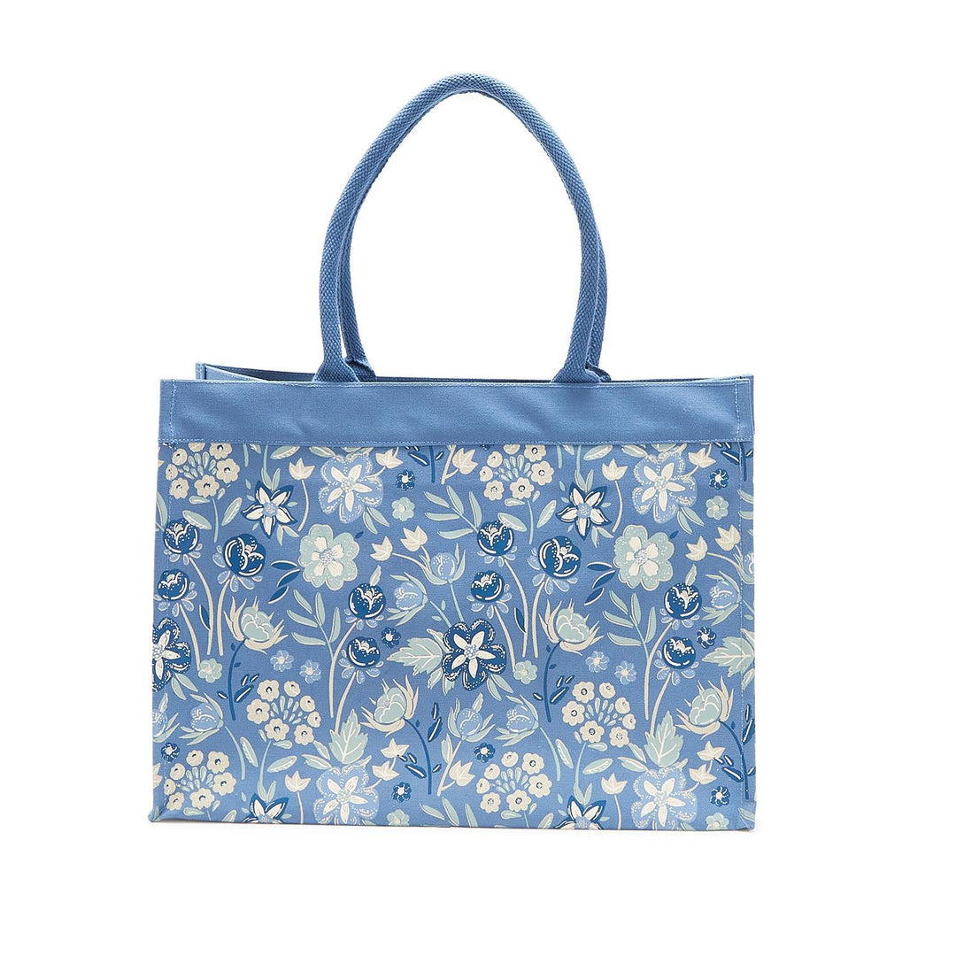 Blue tote bag with floral pattern on a white background