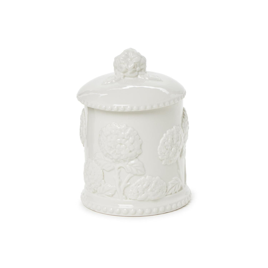White ceramic jar with lid on a white background