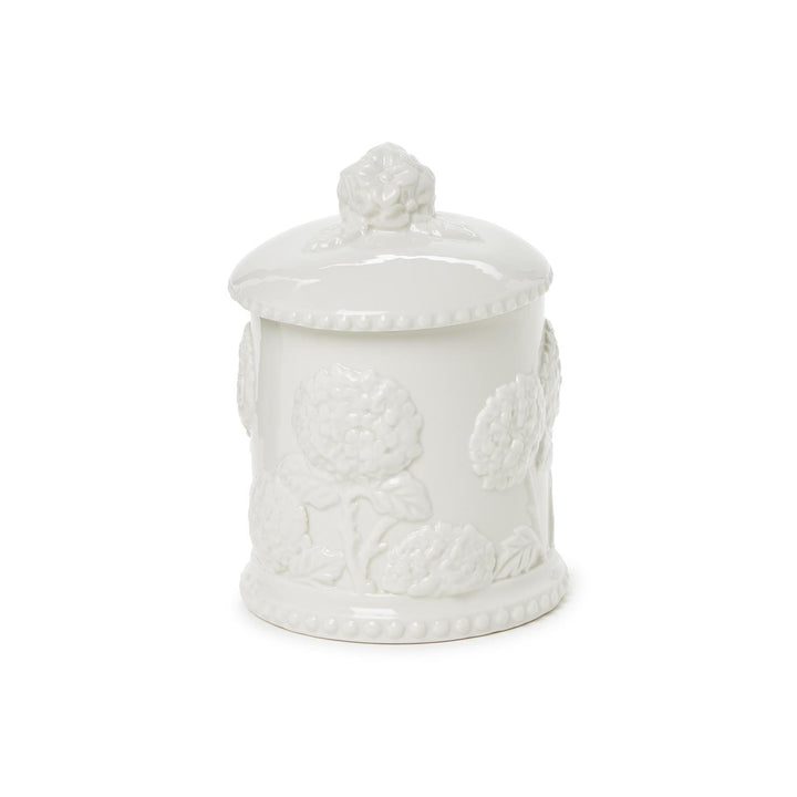 White ceramic jar with lid on a white background