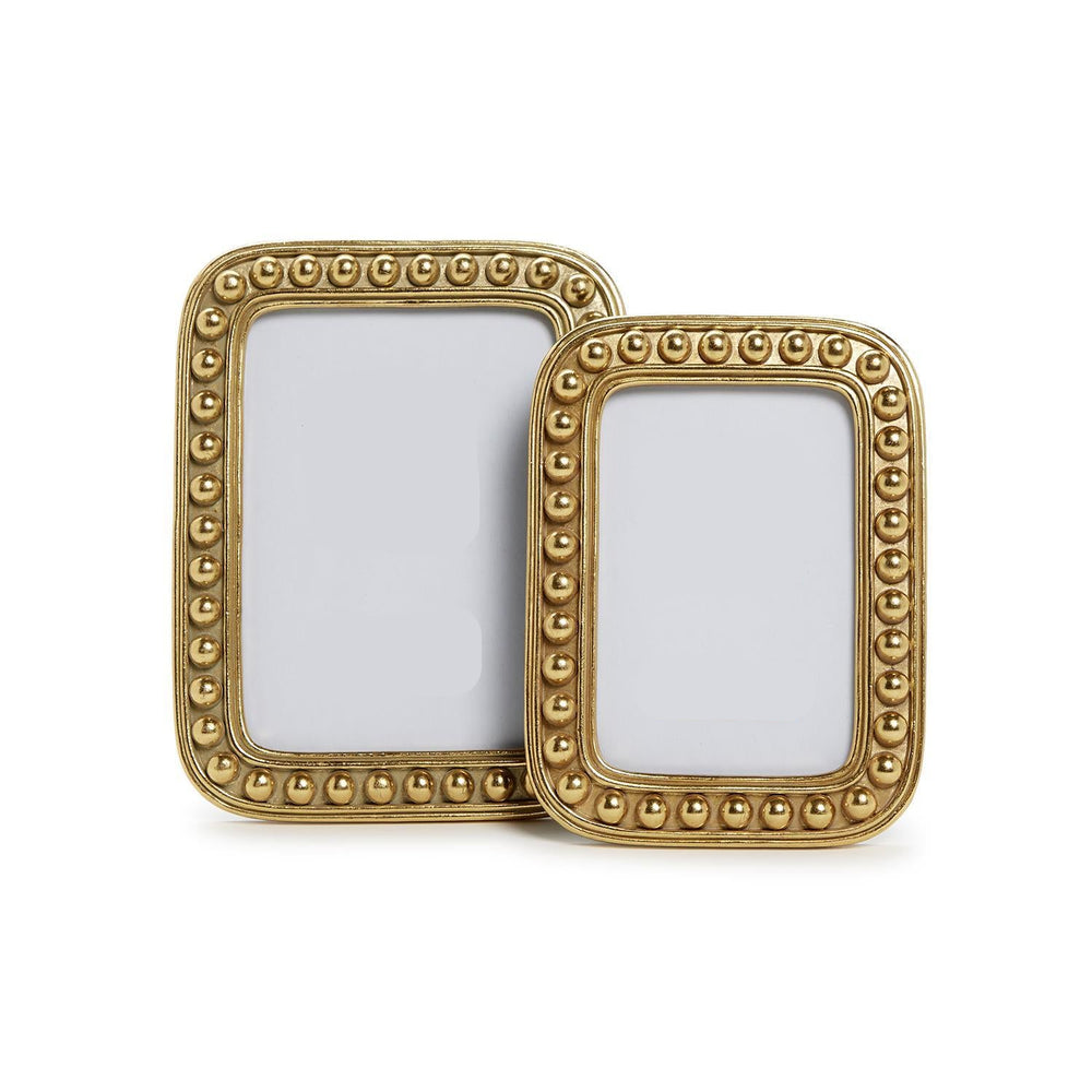 two gold ball frames next to each other