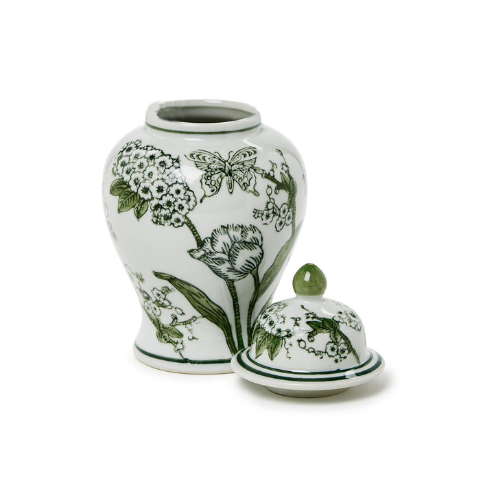 Ceramic jar with green floral and butterfly design on a white background
