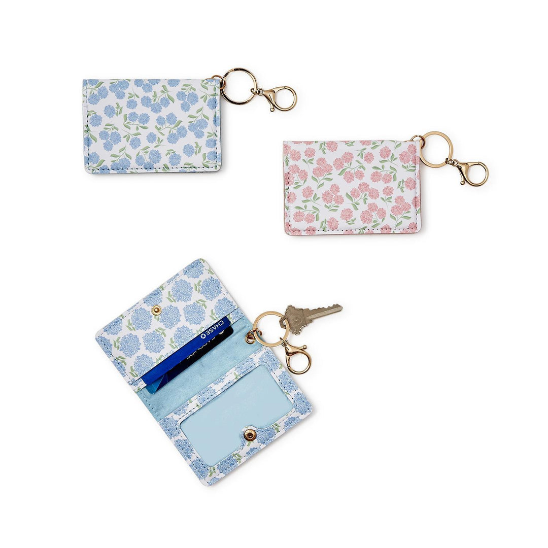 Set of floral card holders with keychains on a white background
