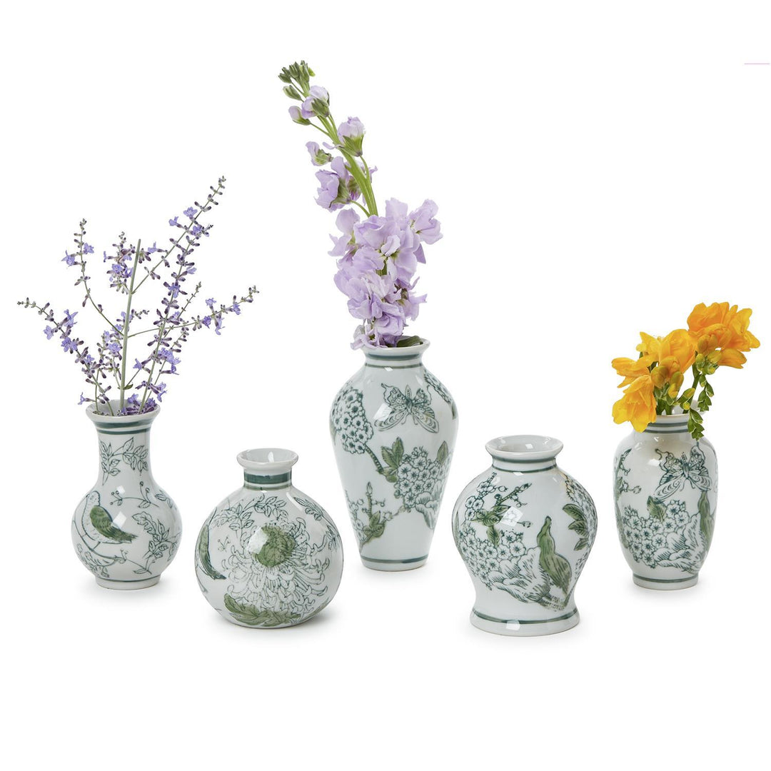 Set of decorative vases with floral patterns and flowers on a white background
