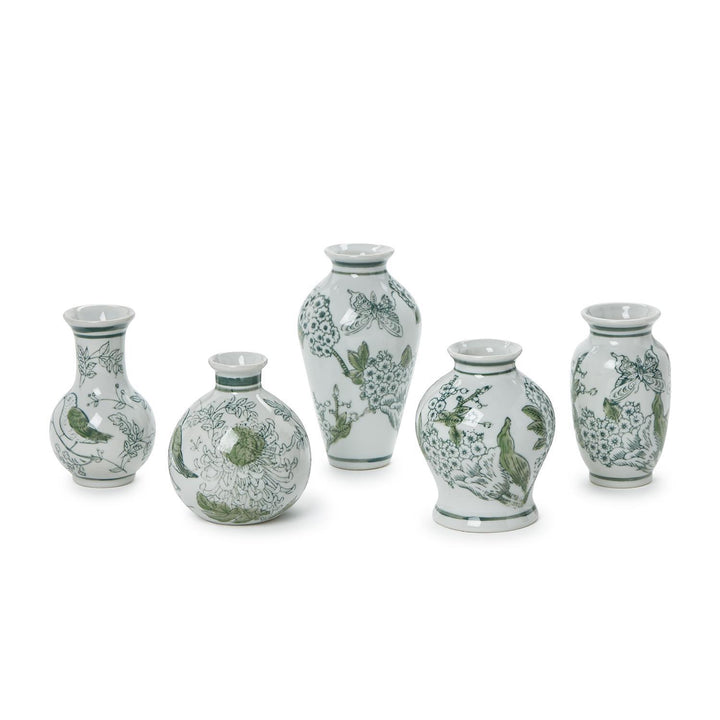 Set of five ceramic vases with green floral patterns on a white background