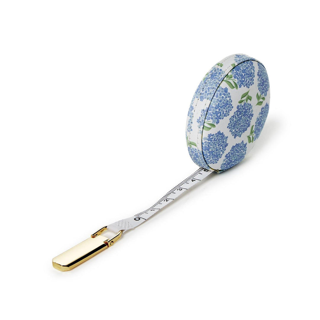 Tape measure with floral pattern on a white background