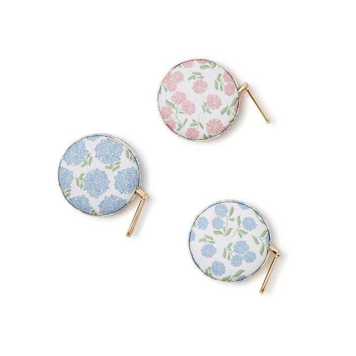 Set of floral patterned earrings on a white background