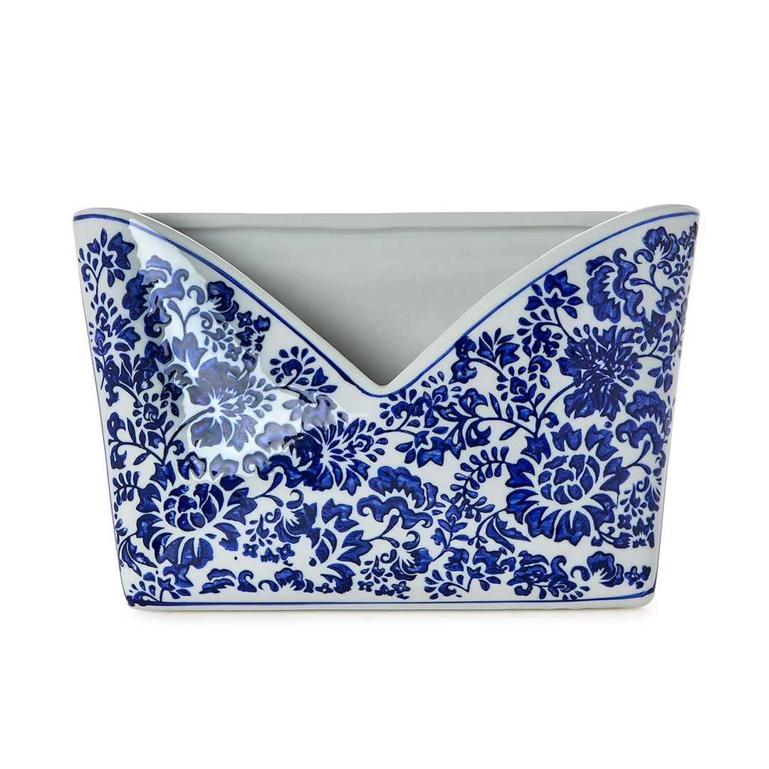 Ceramic planter with blue floral pattern on a white background