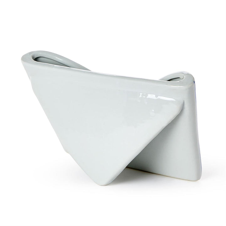 White ceramic vase with a modern design on a white background