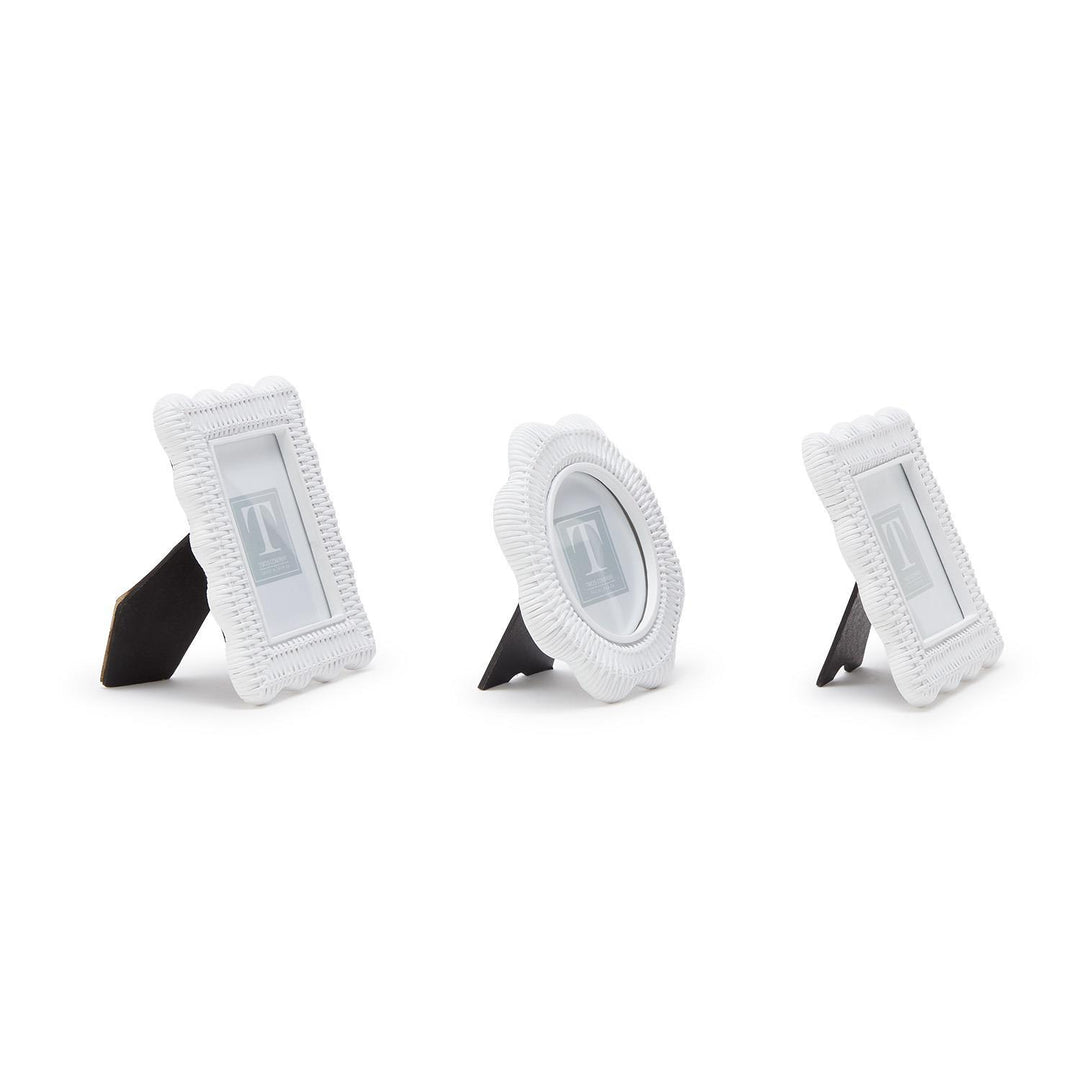 Three white circular objects with stands on a white background