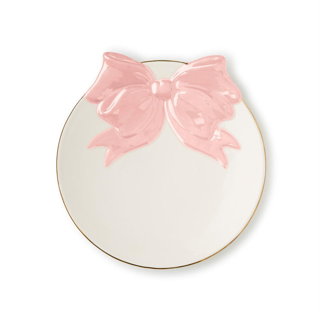 Round ceramic plate with a pink bow on a white background
