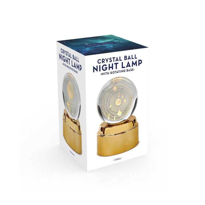 Boxed crystal ball night lamp with gold base on a white background