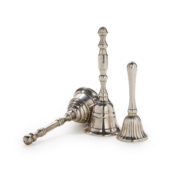 Set of three silver bells on a white background