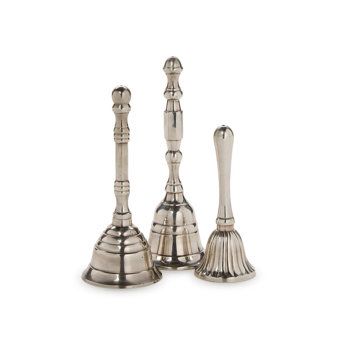 Three silver bells of different sizes on a white background