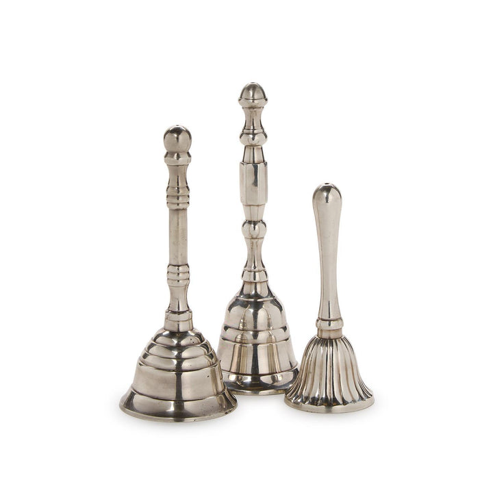 Three silver bells of different sizes on a white background