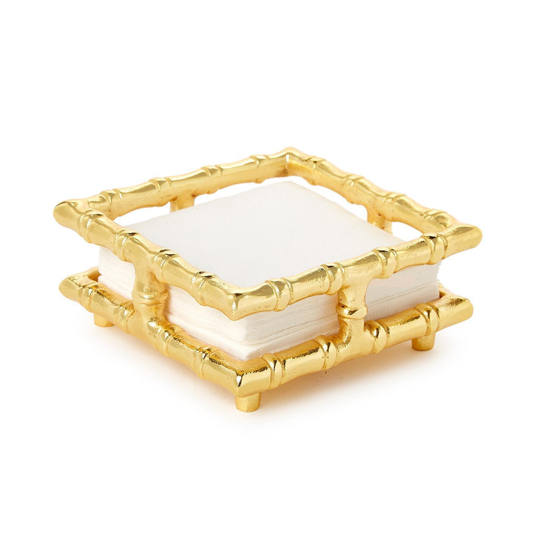 Gold bamboo-style coaster with white center on a white background