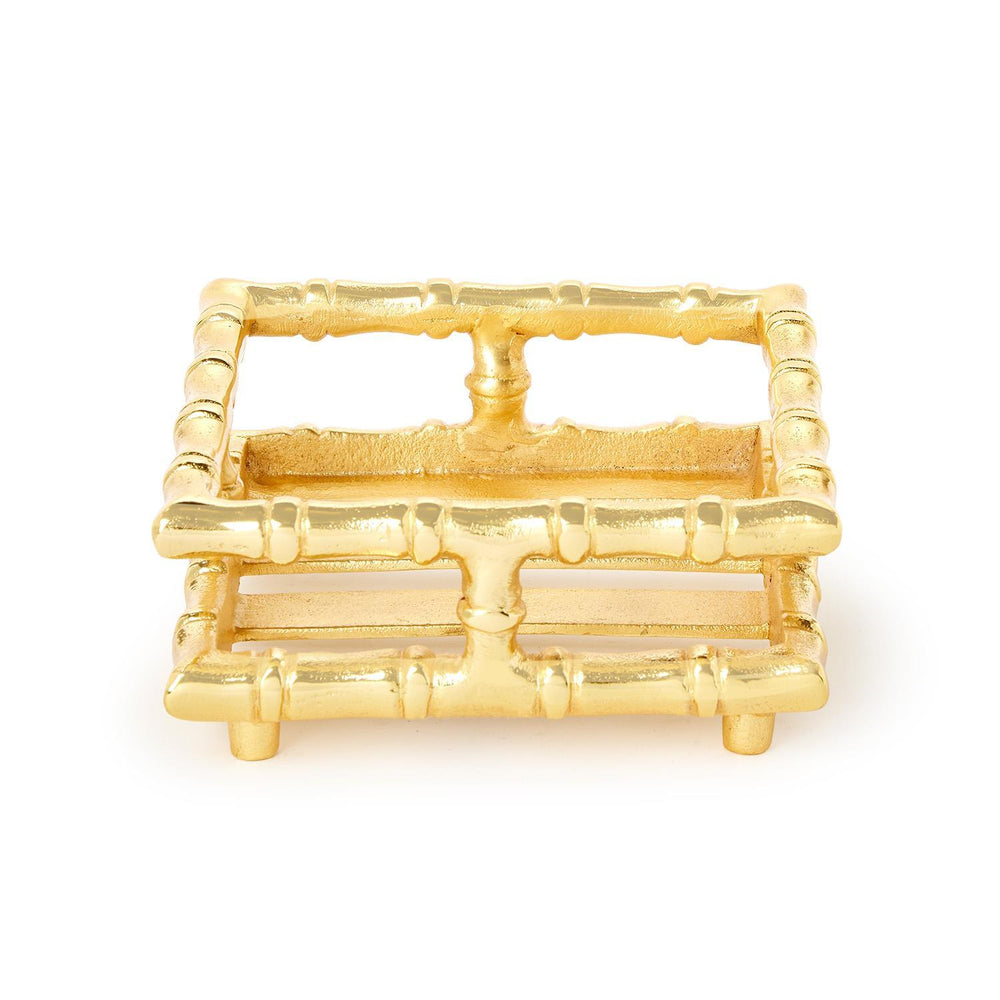 Gold bamboo-style trinket dish on a white background