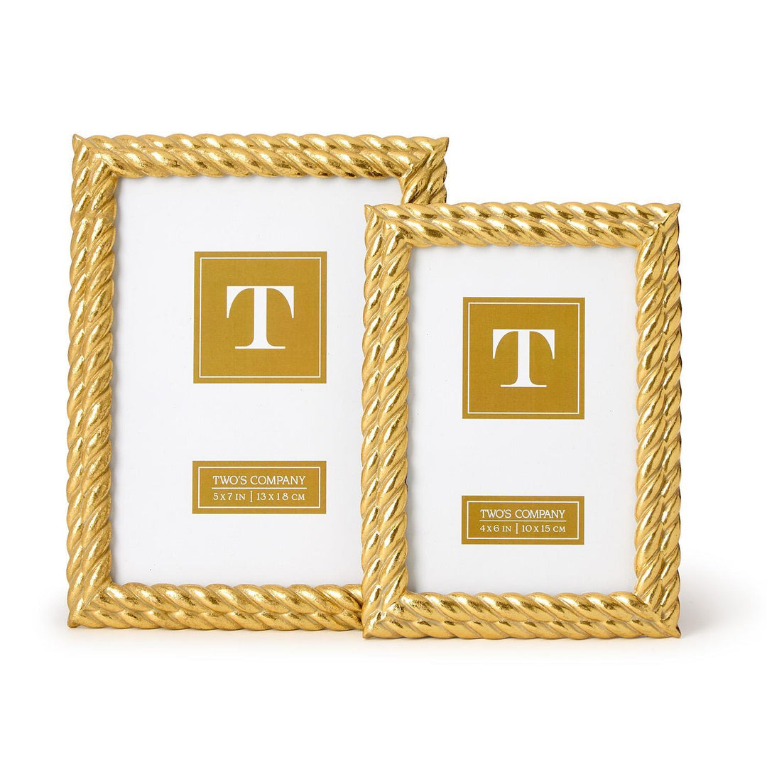 Two gold picture frames with a decorative design on a white background
