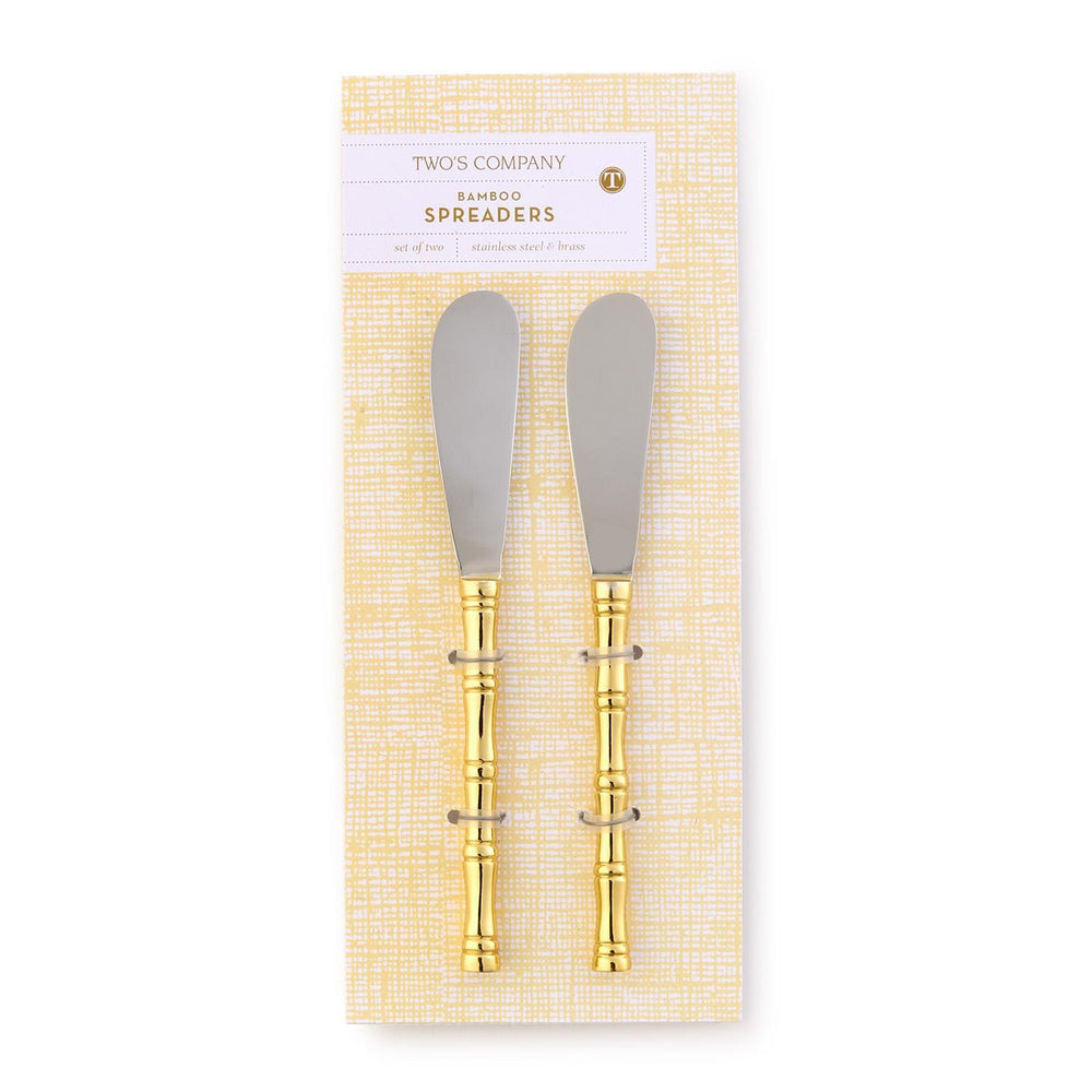 Two bamboo spreaders with gold accents in packaging on a white background