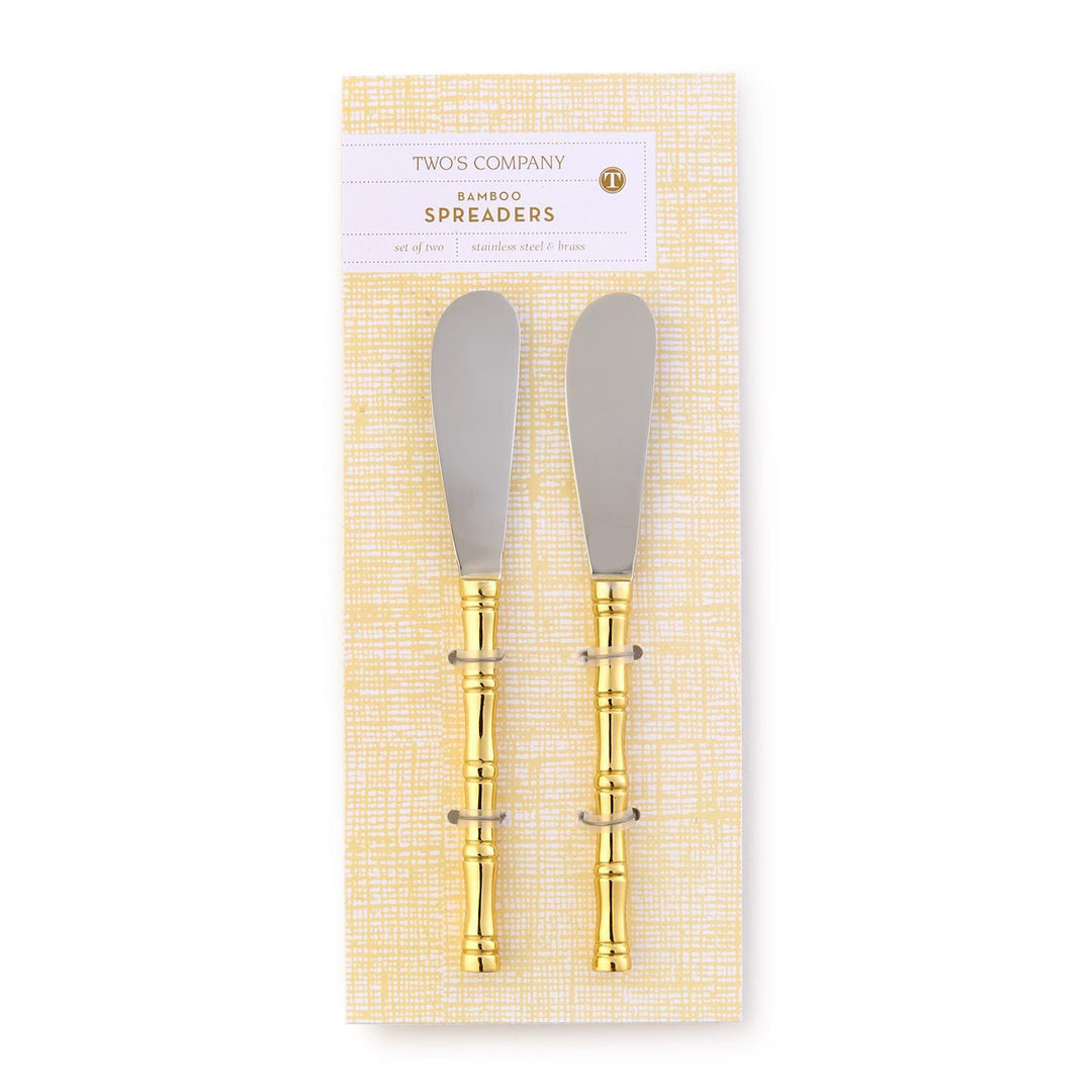 Two bamboo spreaders with gold accents in packaging on a white background