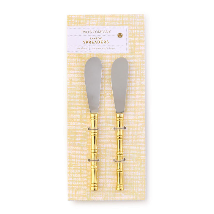 Two bamboo spreaders with gold accents in packaging on a white background