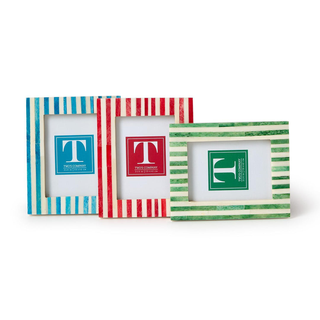 Three colorful photo frames with striped designs on a white background