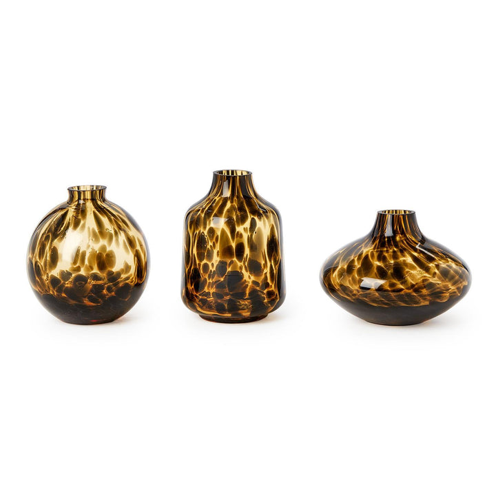 Three tortoiseshell patterned vases on a white background