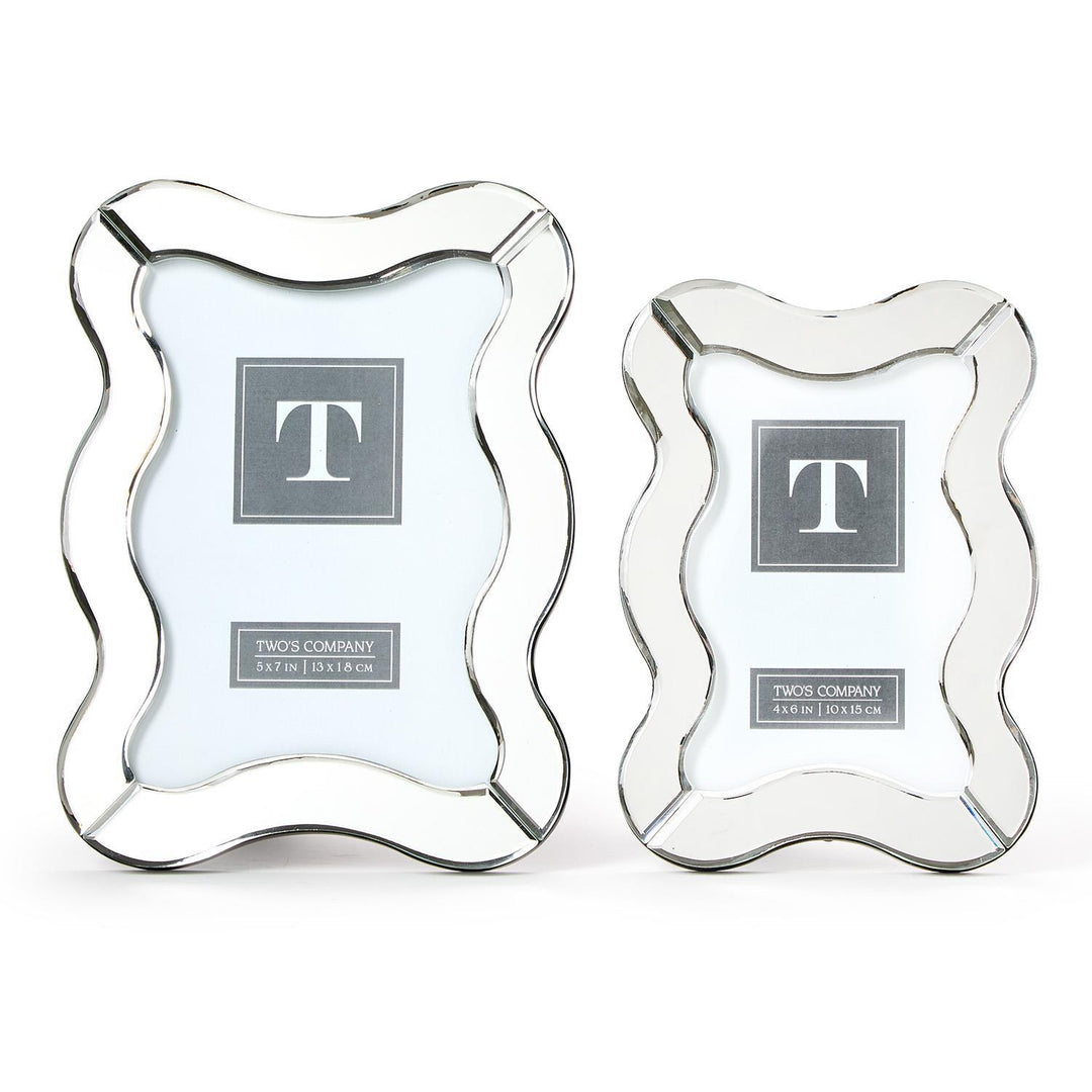 Two decorative picture frames with a wavy design on a white background