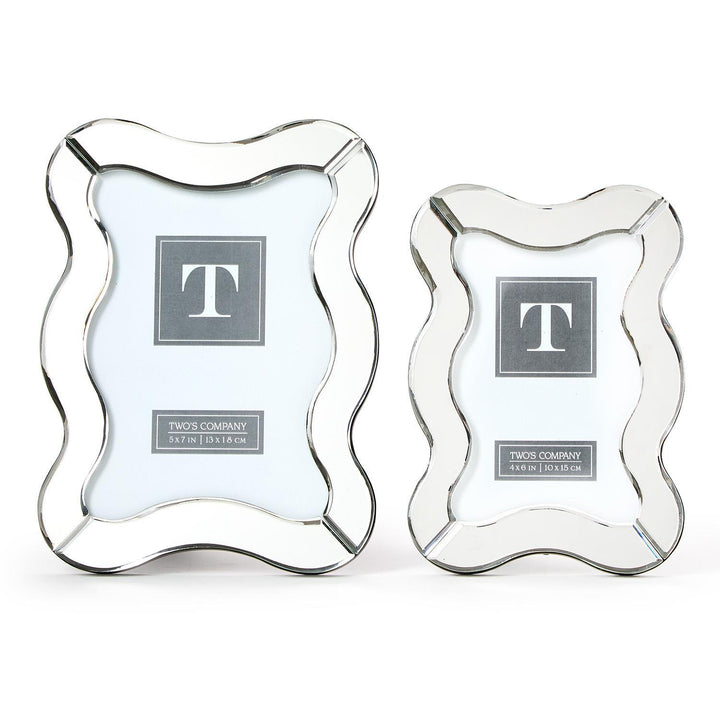 Two decorative picture frames with a wavy design on a white background