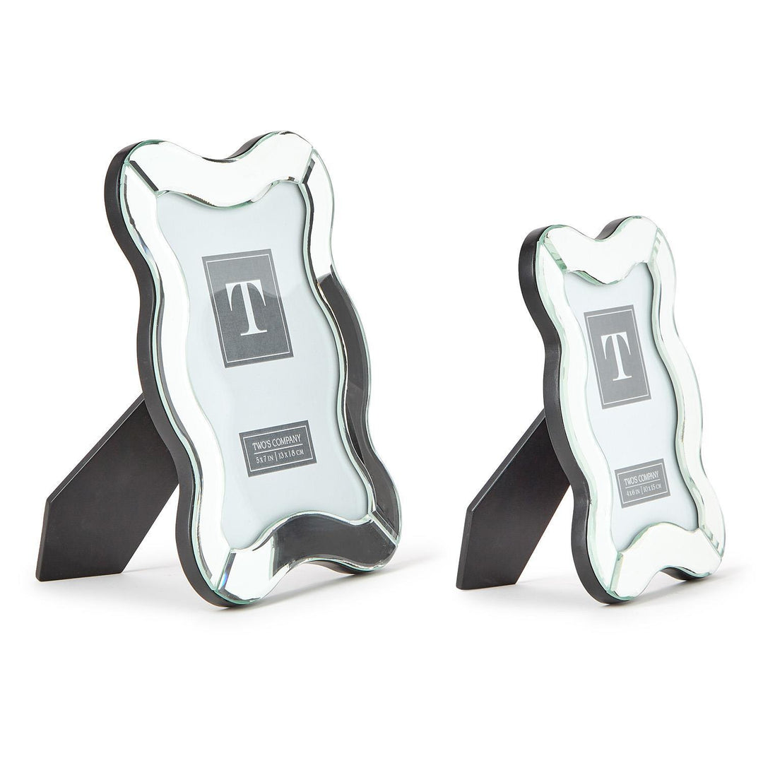 Two mirrored bookends with a 'T' logo on a white background