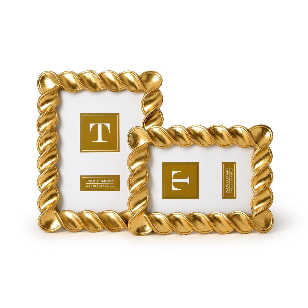 Two gold picture frames with a decorative rope design on a white background