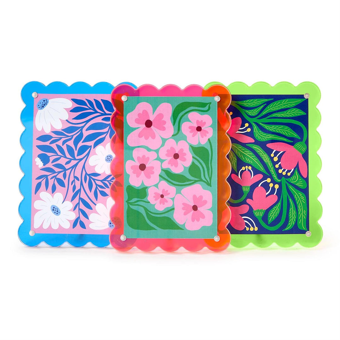 Three colorful decorative cards with floral patterns on a white background