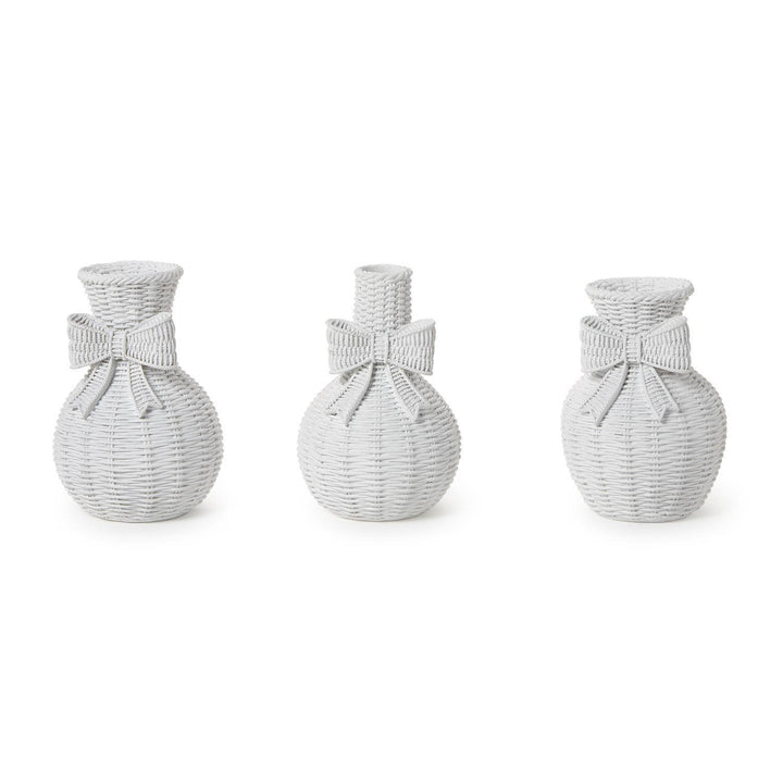 Three woven vases with bow accents on a white background