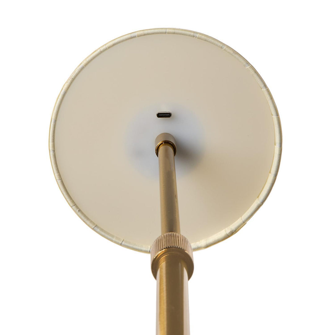 Round beige lampshade with a gold fixture on a white background
