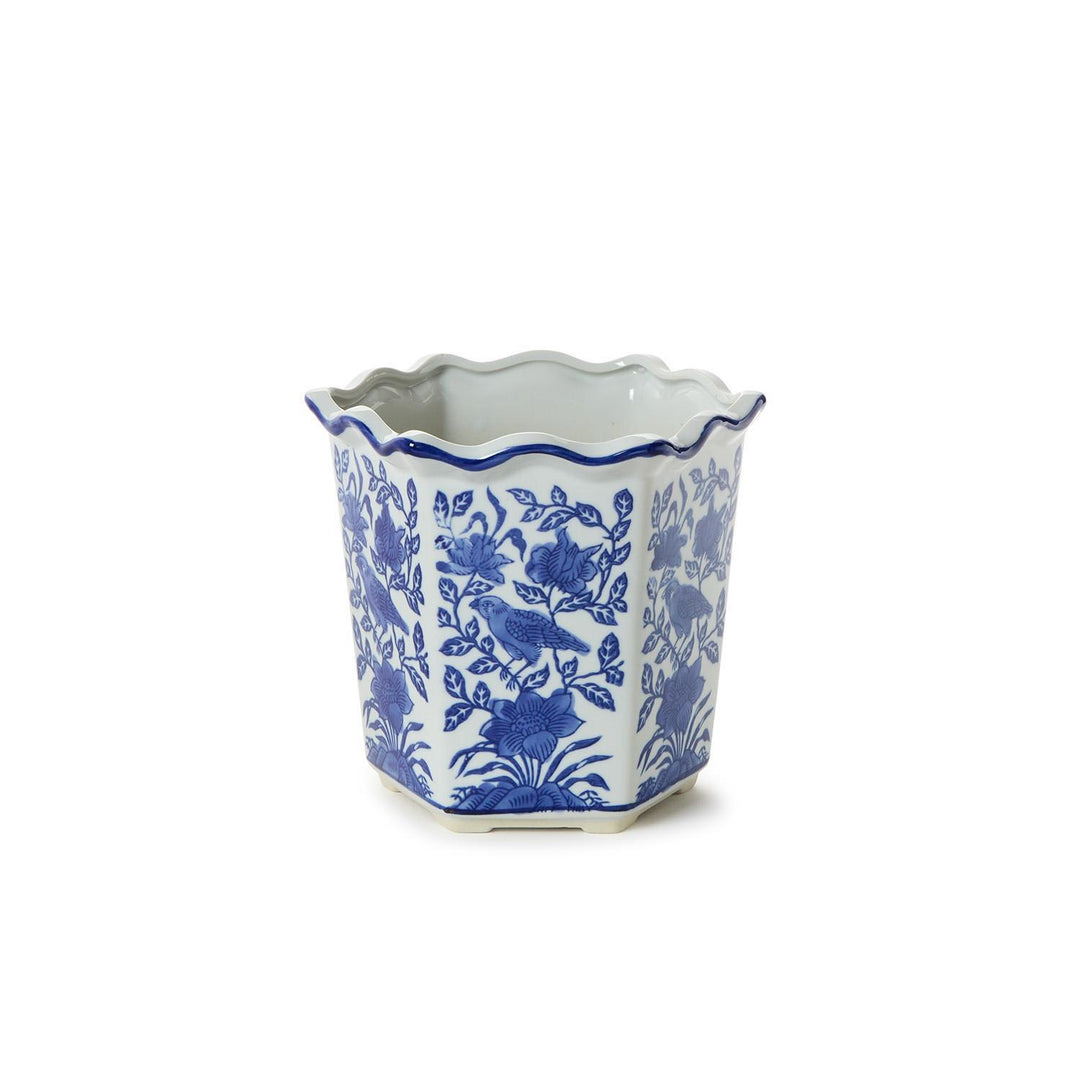Hexagonal ceramic planter with blue floral pattern on a white background