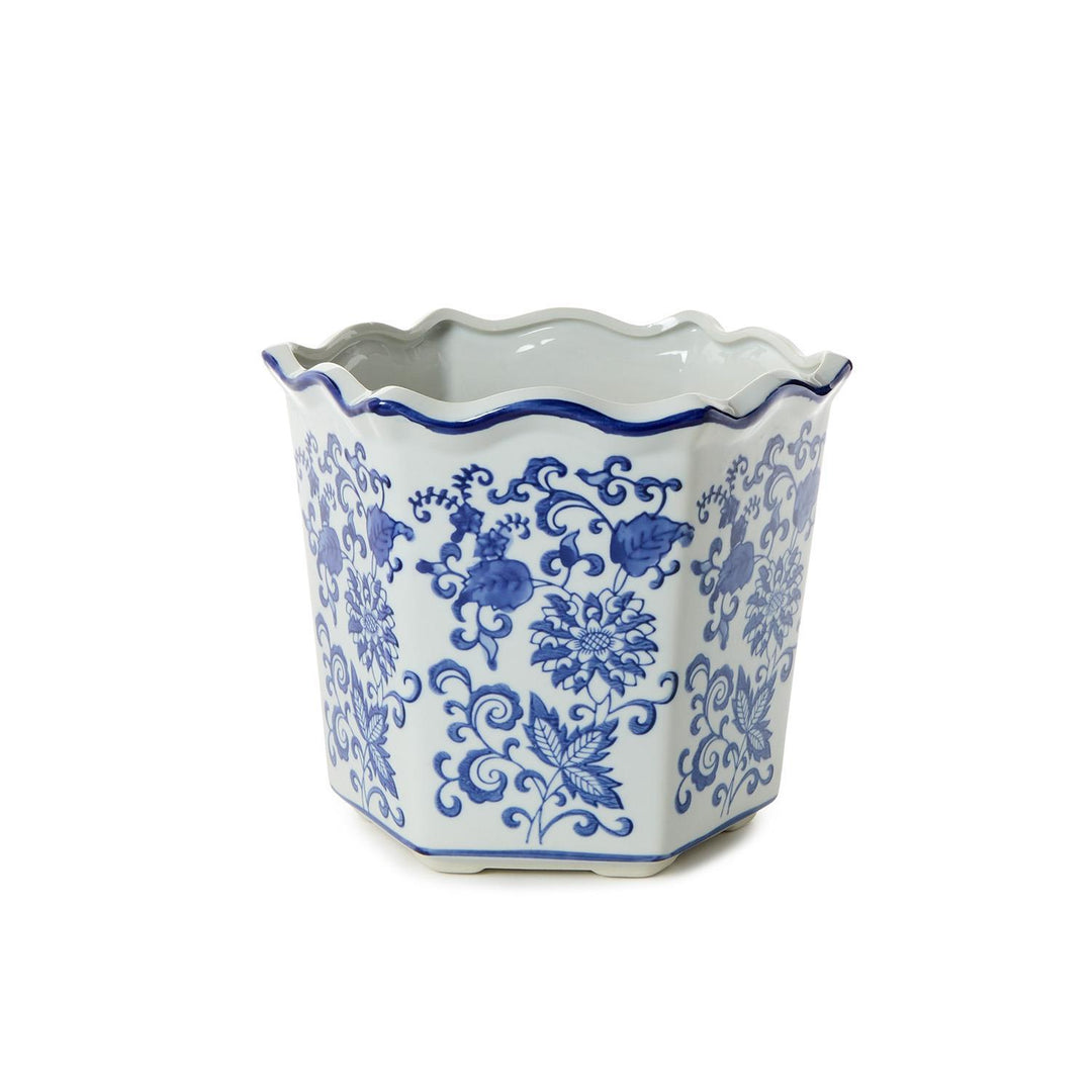 Decorative ceramic pot with blue floral patterns on a white background