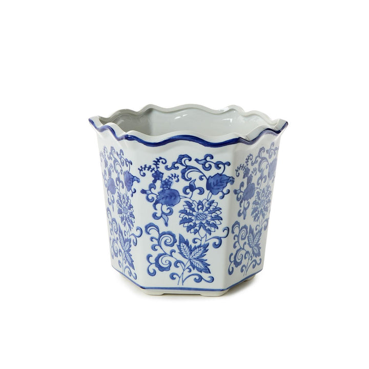 Decorative ceramic pot with blue floral patterns on a white background