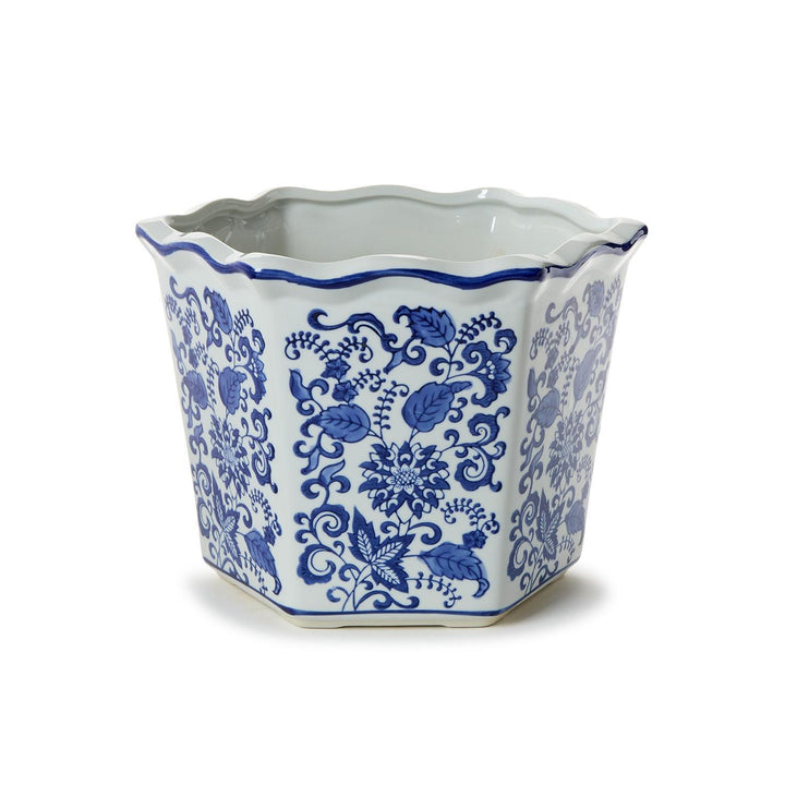 Hexagonal ceramic planter with blue floral patterns on a white background