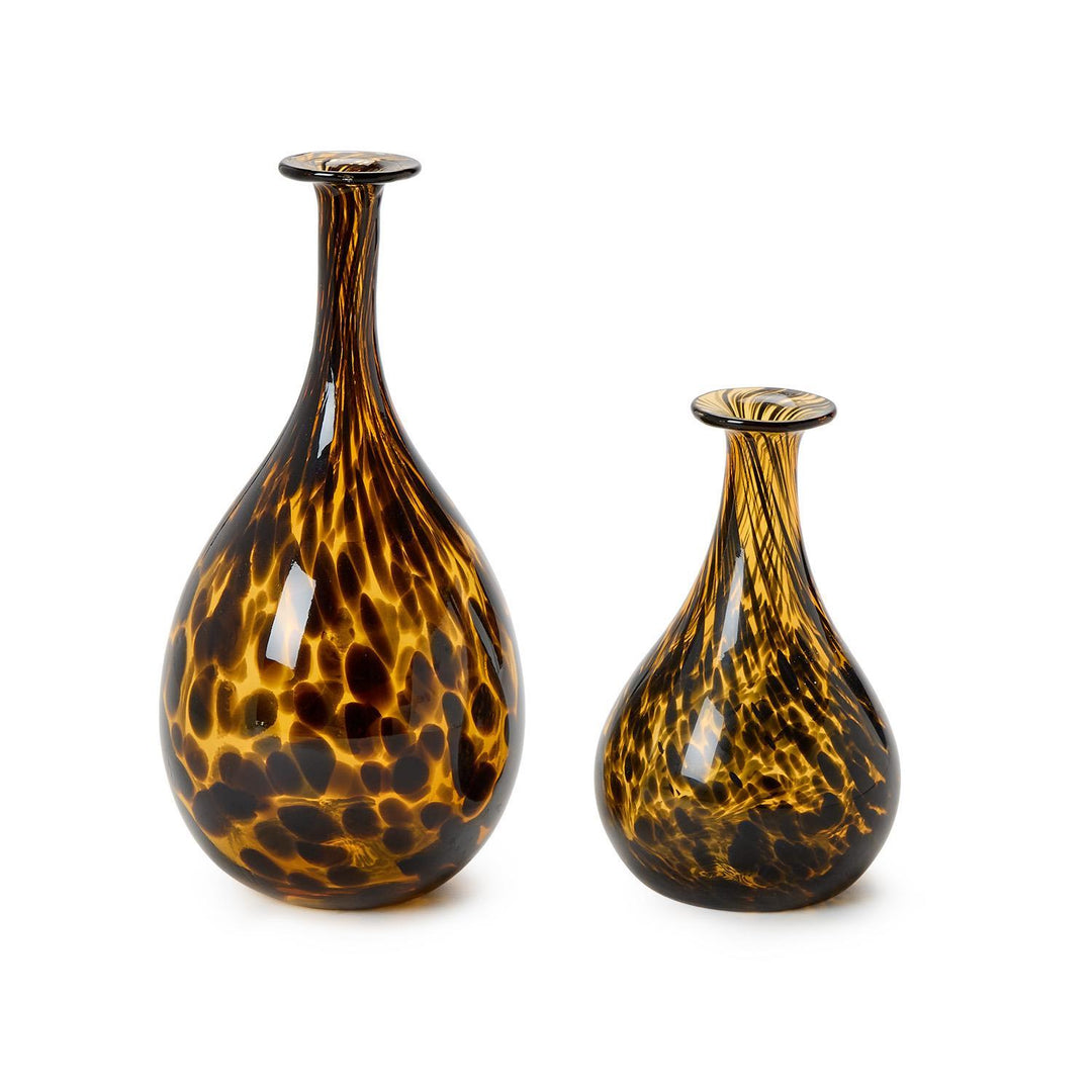 Two tortoiseshell patterned vases on a white background